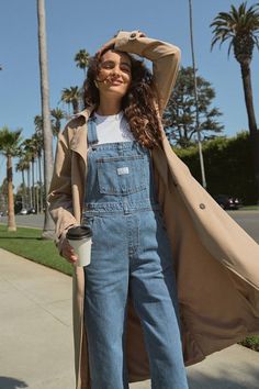 The Levi's Vintage Medium Blue Overalls are a tried and true staple that we know you're going to love! Sturdy denim (in Levi's Foolish Love wash) shapes these classic overalls that have a front bib with a patch pocket (with a logo tag) and adjustable straps that form into a modified racerback. A seamed waist tops relaxed fit straight leg bottoms with two front pockets and two back pockets. Branded button closures at the hips. Red logo tag at back. Fit: This garment fits true to size. Length: Flo Jean Overall Outfits, Overalls Vintage, Vintage Overalls, Blue Overalls, Overall Outfit, Engagement Outfits, Logo Tag, Red Logo, Tried And True