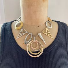 A striking silver and gold tone statement necklace made with salvaged and repurposed mixed metal links and bold geometrical components - designed to turn heads!  This necklace is intended to be worn higher on the neck and measures 41 cm (16 inches) in length. The circular  central pendant has a drop length of 6 cm (approx. 2 1/4 inches).  If you would like extra neck length, please message me after purchase and I will happily add an extension chain. Please note that vintage, salvaged and repurposed components have had previous lives - they have been treasure hunted from flea markets,  thrifted or purchased from second hand sellers online. I don't know the providence of the pieces (ie. who originally made them, how, where or when!) and being second hand they are therefore rarely perfect. Mi Vintage Necklace Antiques, Art Nouveau Necklaces, Charm Choker Necklace, Four Leaf Clover Necklace, Chevron Necklace, Clover Necklace, Art Deco Necklace, Bib Necklaces, Jewelry Birthday