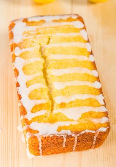 a loaf of lemon pound cake sitting on top of a wooden table