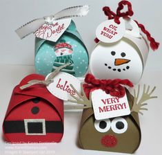 three boxes with christmas decorations on them and one has a snowman ornament