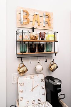 a coffee bar with a clock on the wall and various items hanging from it's shelves