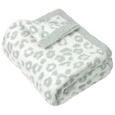 a white and green leopard print blanket