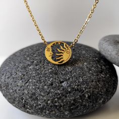 "This golden Sun and moon with stars necklace is a great everyday accessory. The circular shape alone is a symbol of the never-ending circle of life. Placing a half-moon and half sun inside the circle supplies even more meaning. The sun is often recognized as a symbol of rebirth, strength, and power. The moon is associated with the female in many cultures often in the form of a goddess. Perfect for New life Gift, Gift For Her, Wedding Gift Bridesmaid, etc. Diameter of the pendants: almost 1/2\" x 1/2\" = 1.3 cm x around 1.3 cm All my jewelry is lead and nickel free. I am attaching the sun and the sun and the moon together with a matching chain, which I cut to size to create something pretty just for you. Attached is a sizing guide that gives a rough idea of where the necklace will sit. Dep Celestial Stainless Steel Jewelry For Gifts, Spiritual Pendant Necklace With Sun And Moon Design, Spiritual Sun And Moon Jewelry As Gift, Spiritual Sun And Moon Pendant Necklace, Spiritual Sun And Moon Design Jewelry Gift, Celestial Stainless Steel Jewelry With Moon Phase, Celestial Stainless Steel Moon Phase Jewelry, Spiritual Moon-shaped Everyday Jewelry, Spiritual Sun And Moon Round Pendant Necklace