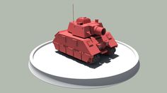 a red toy tank sitting on top of a white object with a shadow over it