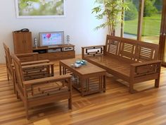 a living room filled with furniture and a flat screen tv on top of a wooden table