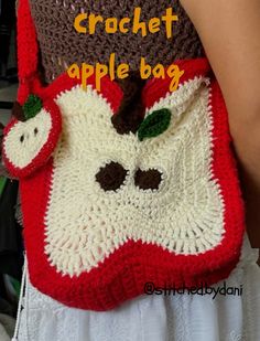 the crochet apple bag is made with yarn