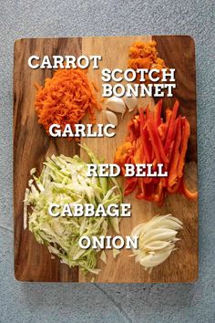 carrots, garlic, red bell cabbage and onion on a cutting board with the words carrot scotch bonnet