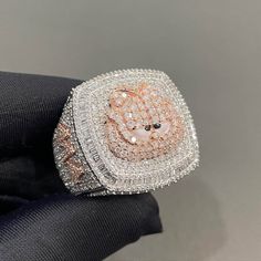 Iced Out Logo Ring, Two Tone Hip Hop Ring For Him, Championship Ring for Men, Custom Number/Logo/ Name Ring in GRA Certified Moissanites Item Details: Ring Size: DM Me Your Ring Size   Metal: 925 Sterling Silver Stone: GRA Certified Moissanites OR AAAAA Cubic Zirconia (CZ) Stone Quality: VVS1 D Color Pristine White Ring Passes Diamond Tester  Description: Our custom iced out Ring are meticulously crafted from premium 925 sterling silver. At IMJ India, we take pride in offering unparalleled quality and craftsmanship, ensuring each piece is a true work of art. Key Features: 1. Premium Stone Options: Choose from two exceptional stone qualities:    - AAAAA+ Highest Quality Cubic Zirconia: Radiate brilliance and sophistication with our premium cubic zirconia stones, carefully selected for their Number Logo, Queen Rings, Mens Pinky Ring, Hip Hop Rings, Expensive Jewelry Luxury, Logo Name, Name Ring, Championship Rings, Letter Ring