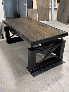 a table that is sitting in the middle of some kind of flooring area with other items behind it