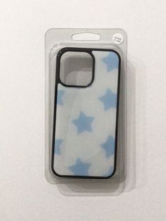 a case with blue stars on it sitting in a packaging package for a cell phone