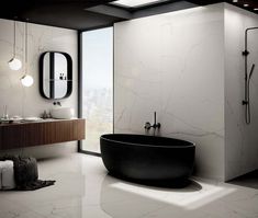 a bath tub sitting next to a walk in shower