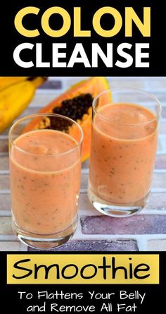 two glasses filled with smoothie sitting on top of a table