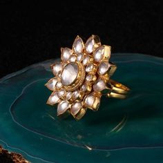 White Flower Ring Riana by Shikha Jindal - Fabilicious Fashion Flower Shaped Jewelry For Puja And Festivals, Floral Jewelry For Puja And Festivals, Festive Gold Jewelry With Flower Decoration, Traditional Gold Flower Ring For Festive Occasions, Traditional Yellow Gold Flower Ring For Gift, Traditional Yellow Gold Flower Ring As Gift, Traditional Yellow Gold Flower Ring Gift, Traditional Yellow Gold Flower Ring, Jadtar Ring