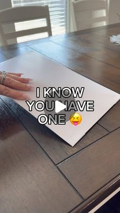 a woman's hand on top of a piece of paper that says i know you have one