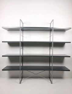 an empty shelf with several shelves on it