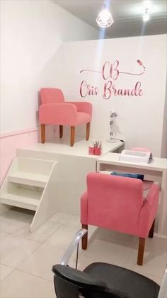 a salon with pink chairs and white walls