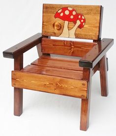 a wooden chair with a mushroom painted on it