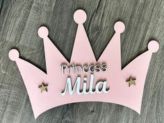 a pink princess tiara with the word'princess milla'cut out on it