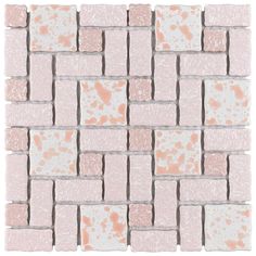 a pink and white tile wall with small squares