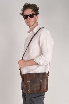 RusticVintage Men's Handmade Bag brings to you this Handmade bag which is suitable for carrying around your office stuff along with your daily items. The Handmade bag is made from PU Leather matterial and comes in an attractive colour. It is designed and can be used by Men & Boys.  Product Type: Cross body messenger travel Bag  Product description: Perfect messenger bag/shoulder bag/cross body bag/handbag/ hiking or travelling Bag, suitable for office, school, outdoor, business and other occasions. Freely adjustable shoulder strap, you can adjust it according to your height and comfort requirements. The White stitching on this product make it uniqe and attractive. Retro Business Crossbody Shoulder Bag, Vintage Shoulder Bag With Luggage Sleeve For Everyday Use, Vintage Crossbody Laptop Bag For Daily Use, Brown Shoulder Bag With Laptop Sleeve For Everyday, Vintage Everyday Laptop Bag, Vintage Business Shoulder Bag With Waxed Finish, Vintage Everyday Carry Shoulder Bag, Vintage Bags With Laptop Sleeve For Everyday Use, Vintage Bag With Laptop Sleeve For Everyday Use