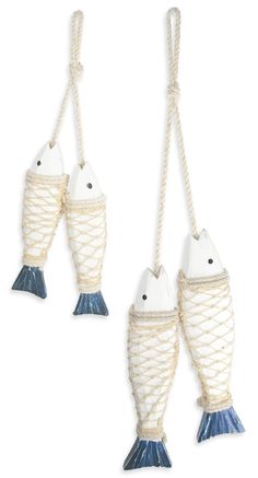 two white fish hanging from ropes on a white background, one is blue and the other is white