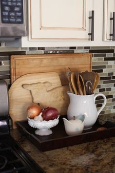 the kitchen counter is clean and ready to be used as a utensil holder