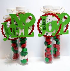 two glass bottles with candy in them and the word pop spelled out