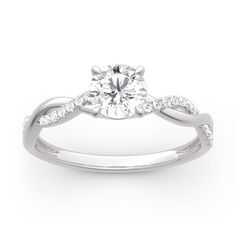 a white gold engagement ring with diamonds on it