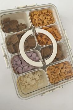 a plastic container filled with lots of different types of nuts