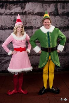 a man and woman dressed as elves standing next to each other