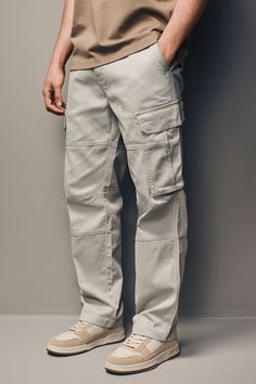 The perfect casual cargo trouser. Made from a comfortable cotton fabric, these utility inspired trousers feature a concealed zip fly and six practical pockets. Classic cargo styling with a modern twist; we offer this style in slim or straight fit to best cater to your unique style. 98% Cotton, 2% Elastane. Cargo Pant For Men, Best Cargo Pants For Men, How To Style Cargo Pants Men, Cargo Pants Outfit Men Casual, Cream Cargos Outfits Men, Mens Cargo Outfit, Cargo Pant Men, Slim Cargo Pants Men, Pant For Man