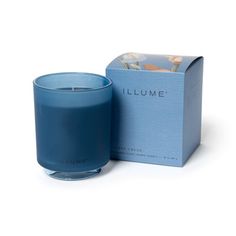 a blue candle sitting next to a box