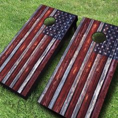 an american flag themed cornhole board on the grass with a hole in the middle