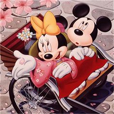 mickey and minnie on a motorcycle with cherry blossoms