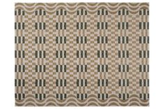 a beige and green rug with squares on it