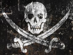 a skull and crossbones painted on the side of a building with two swords