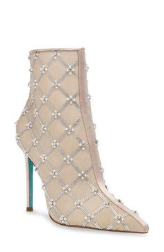 Sparkling crystals and pearly beads dazzle on this pointy-toe boot lifted by a stiletto heel. 4" heel 5 1/2" shaft Side zip closure Textile upper/synthetic lining and sole Imported Pointy Toe Boots, Dress Booties, Fall Wardrobe Essentials, Platform Slippers, Baby Boy Shoes, Boy Shoes, Stiletto Heel, Boot Shoes Women