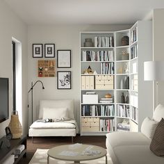 a living room filled with furniture and a flat screen tv