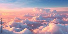 the sky is filled with clouds and pink hues as seen from an airplane window