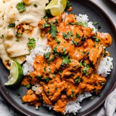 a plate filled with rice, chicken and cilantro sauce next to tortillas