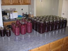 many jars are lined up on the counter