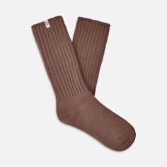 Made from a soft rib knit and crafted with Responsible Cotton, the Tyla Slouchy Crew sock is designed for a slouchier fit. | Slouchy Cotton sock. 97% Cotton/2% Recycled Polyester/1% Elastane. Made from Responsible Cotton. 11 inch height. Soft twill tape with The UGG® Logo on top cuff. Fits shoe size: 5-10. Imported. | UGG® Women's Tyla Slouchy Crew Sock Cotton Blend Socks in Allspice Brown Socks For Fall Stocking Stuffer, Comfortable Brown Mid-calf Socks, Cozy Soft Brown Socks, Cozy Brown Socks For Stocking Stuffers, Brown Knitted Socks For Fall, Comfortable Cozy Ribbed Socks, Comfortable Ribbed Cozy Socks, Comfortable Soft Brown Socks, Comfortable Ribbed Knee-high Socks For Fall