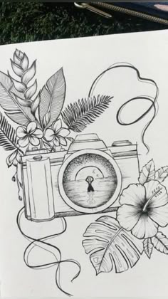 a drawing of a camera and some flowers