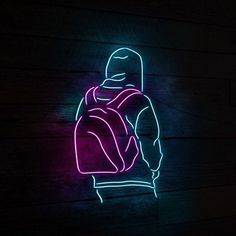 a neon sign that is on the side of a wooden wall with a person wearing a backpack