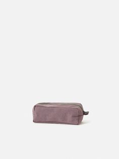 a small purple bag sitting on top of a white surface