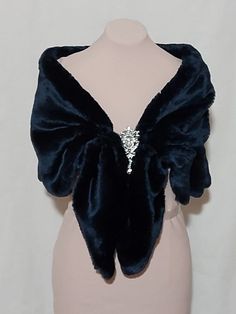 This elegant dark blue faux fur capelet was designed for that special day or evening wedding. The design of this capelet is elbow length. (Measures Approx 18" , Will Fit Up To 45 inch circumference (Fits Small -Plus size)  Since every garment is created  for you-  For best accurate results, measure yourself& compare with the detailed size chart below:  fur capelet with bow closure length                        small          40 in medium     43 in large          47 in INSTRUCTIONS WHEN ORDERING: Blue Fur Jacket, Blue Outfit Winter, Fur Capelet, Short Fur Coat, Winter Cloak, Dark Blue Wedding, Blue Winter Wedding, Fox Scarf, The Empyrean