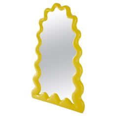 a yellow mirror with wavy edges on a white background