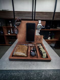 an open wooden case with various items in it