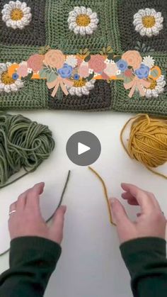 someone is crocheting together with yarn and flowers