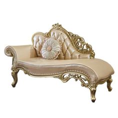 an antique style chaise lounge with gold trimmings and pillows on the back